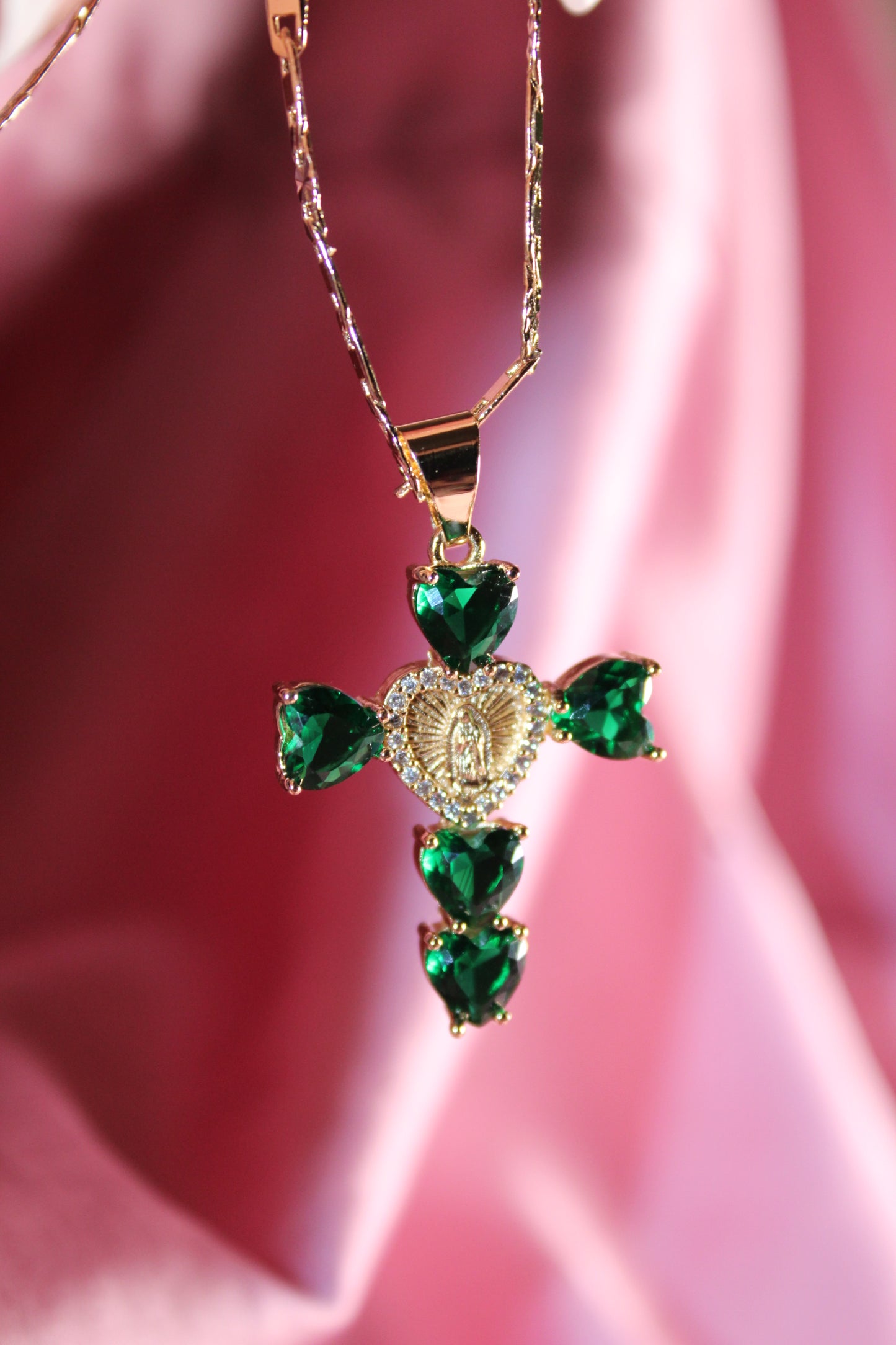 Green heart shaped cross