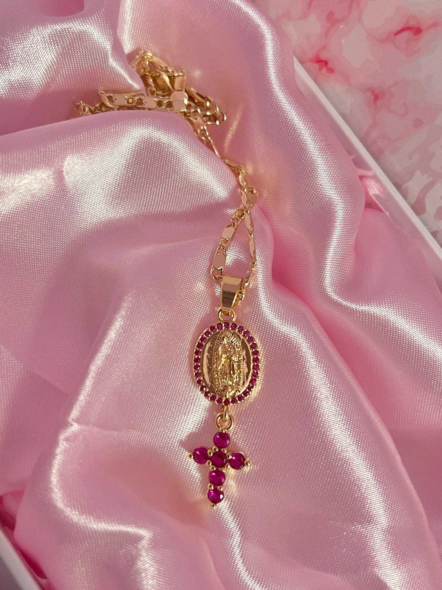 Pink virgencita with hanging cross