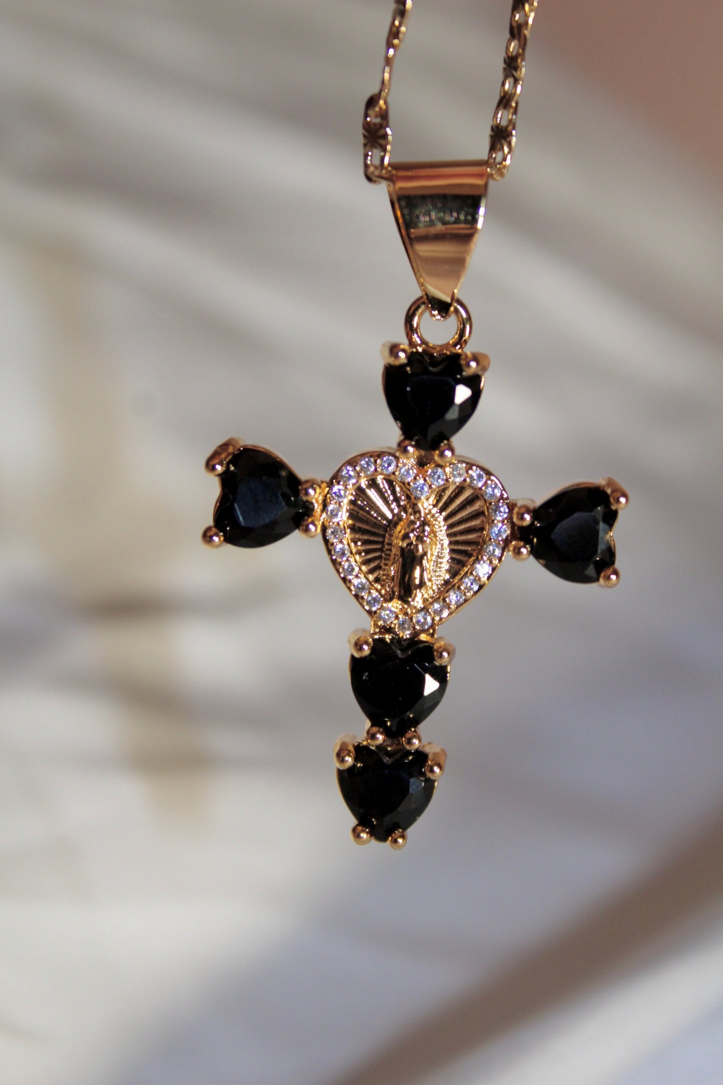 Black heart shaped cross