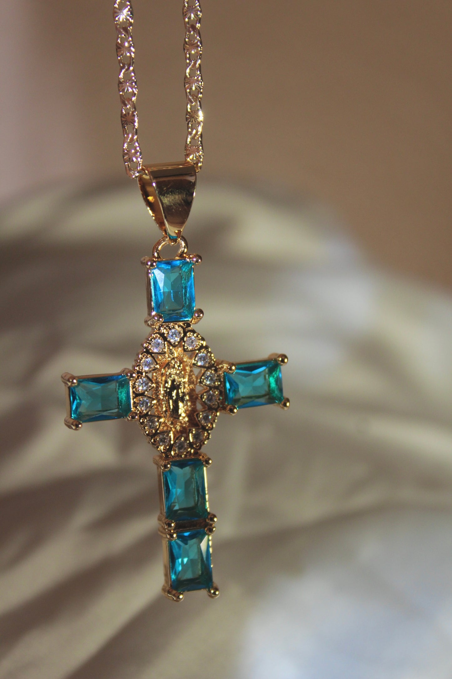 Blue cross with hearts in center