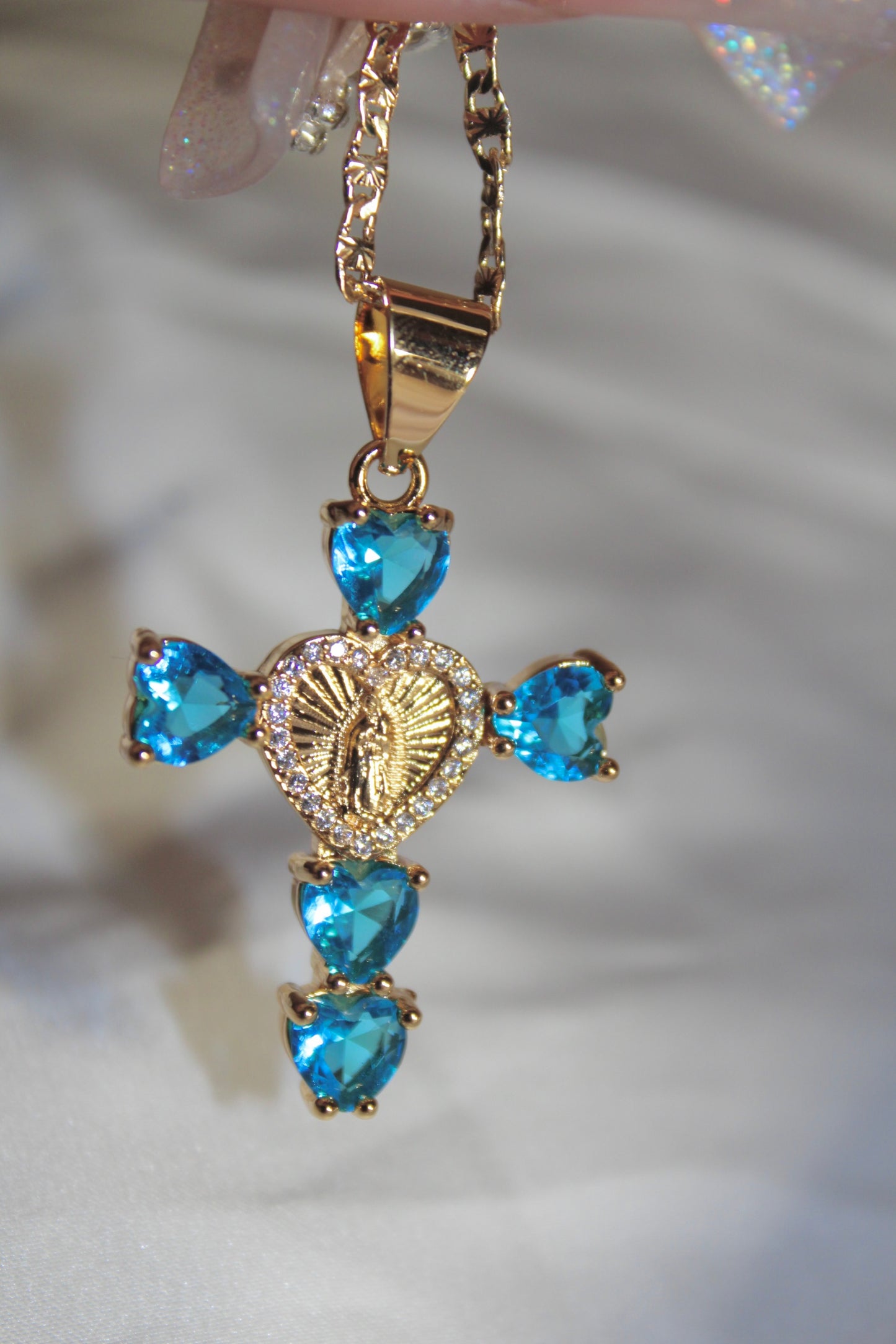 Blue heart shaped cross