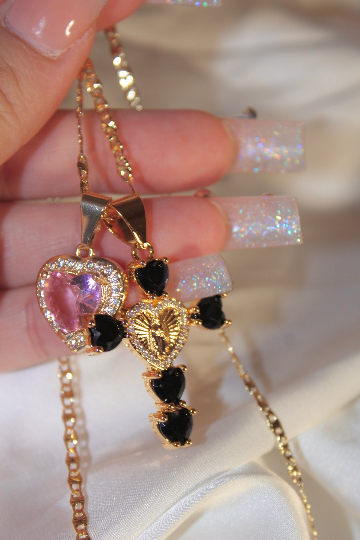 Black Heart shaped cross with pink heart